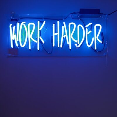 blue Work Harder neon signage