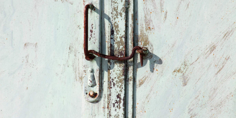 old metal pen with union hook on the gate.