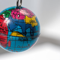 Old key chain in the shape of a small Earth globe