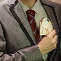 800px-4_-_corruption_-_man_in_suit_-_euro_banknotes_hidden_in_left_jacket_inside_pocket_-_royalty_free,_without_copyright,_public_domain_photo_image